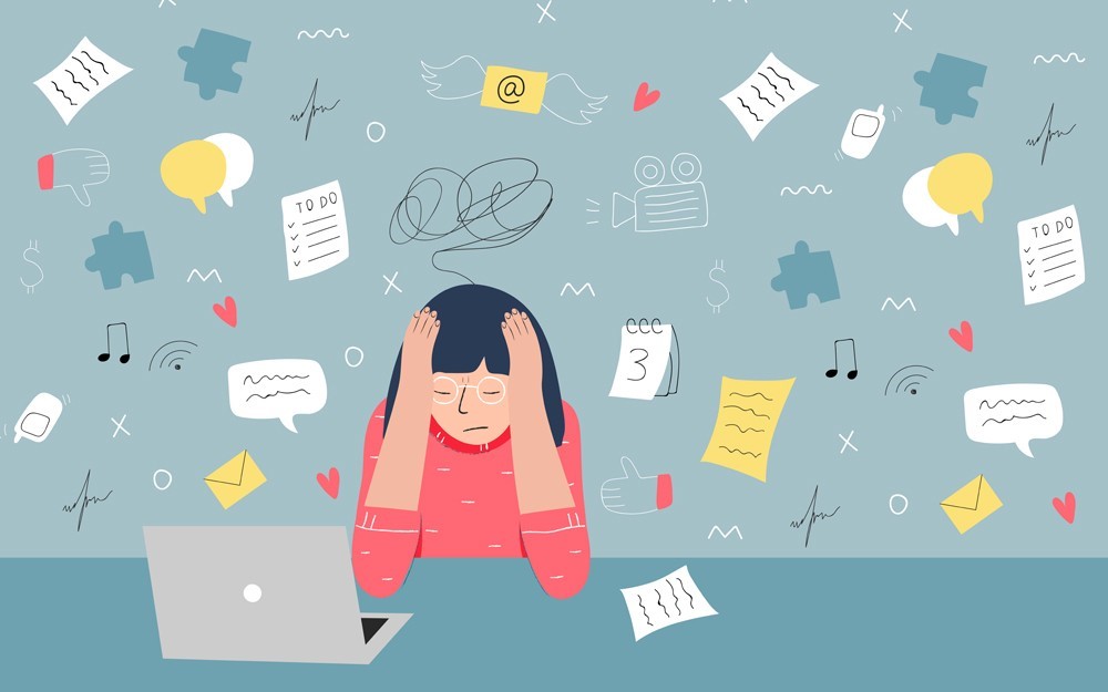 Lady grasping head, surrounded by overwhelming responsibilities
